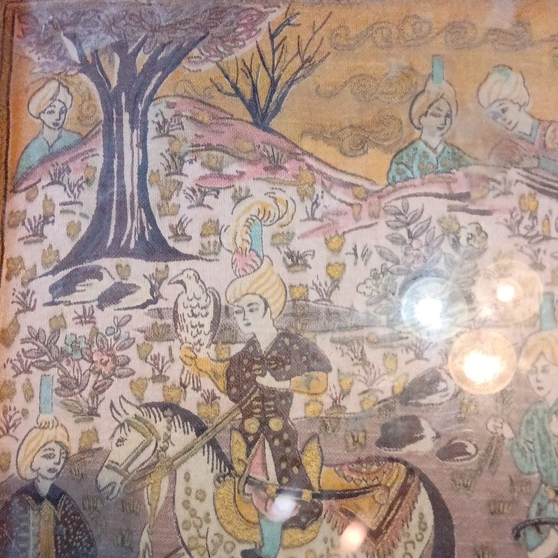 Persian Qajar dynasty lacquer painting depicting a hunting scene.
