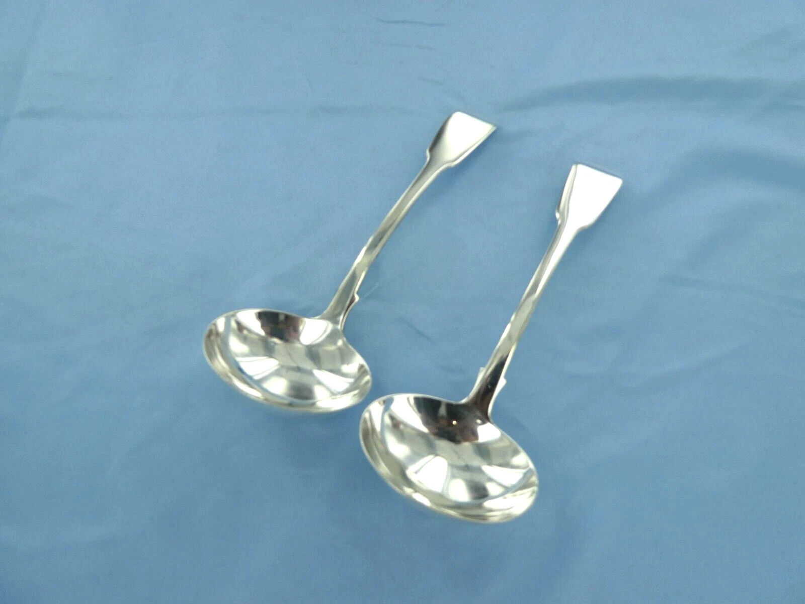 AN ANTIQUE PAIR OF STERLING SILVER FIDDLE BACK SAUCE LADLES LONDON 1821.
Opens in a new window or ta