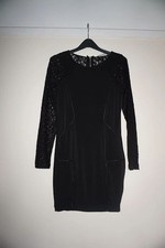 Tight bodycon black dress with lace sleeves