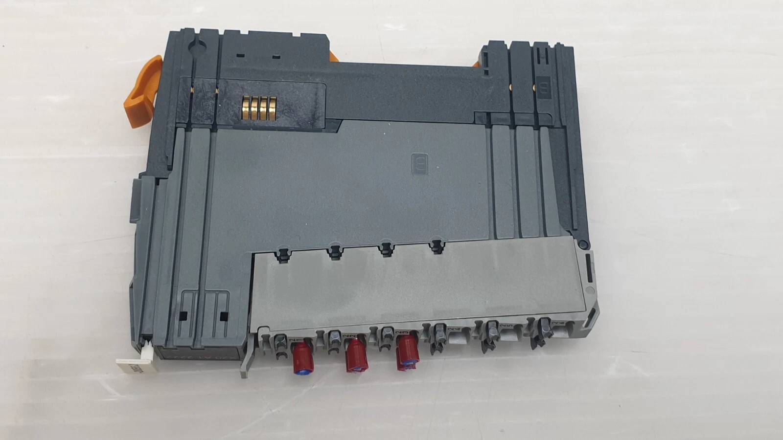 Back of the X20AT2222 with grey terminal block and red wire entries