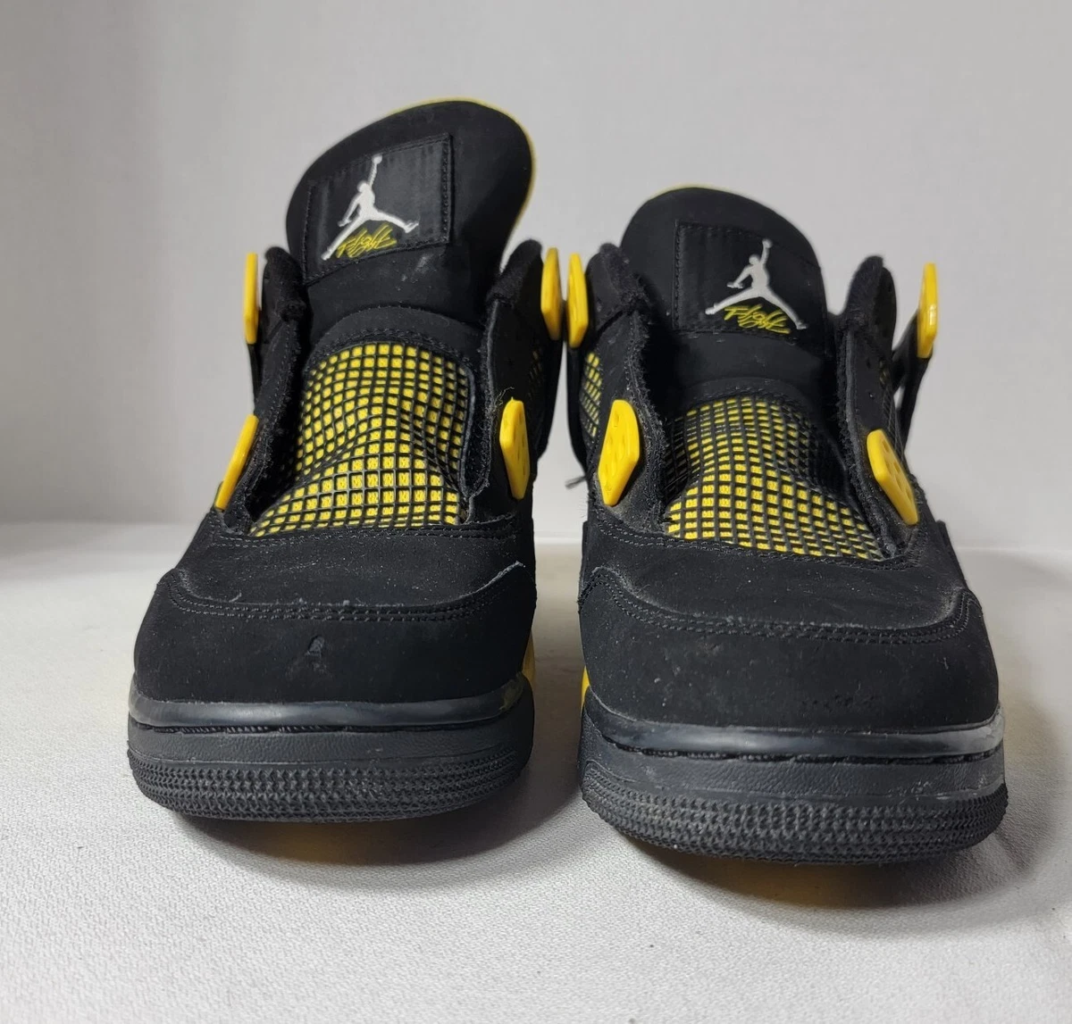 Air jordan retro 4 iv thunder black hot sale yellow