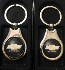 Chevrolet Keychain 2 Pack Gold Black 1 Glass Dome Chrome Finish Chevrolet Keychain 2 Pack Gold Black 1 Glass Dome Chrome Finish