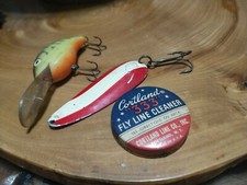 Vintage Fishing Lures. Dardevlf, Rebel deep R, Cortland fly line cleaner tin