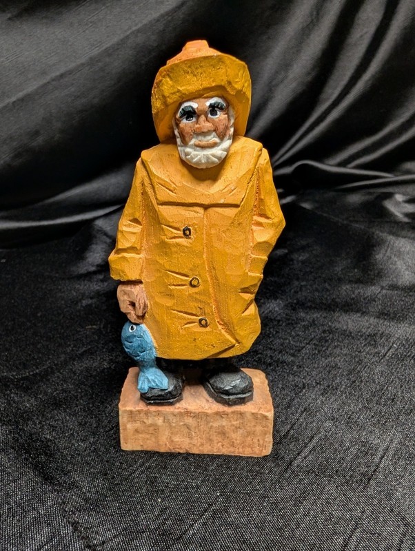 Vintage ceramic, chalkware, or porcelain folk art fisherman from Germany