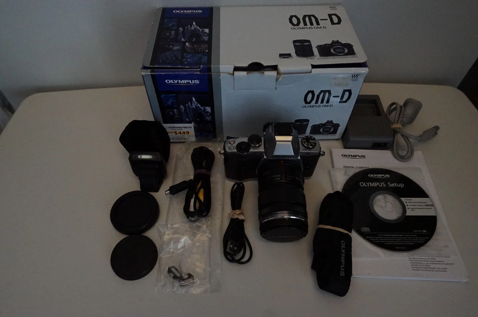 Olympus OM-D E-M5 + 12-50 Lens, Flash + cables, neck strap, manuals, CD, box - image 2 of 4