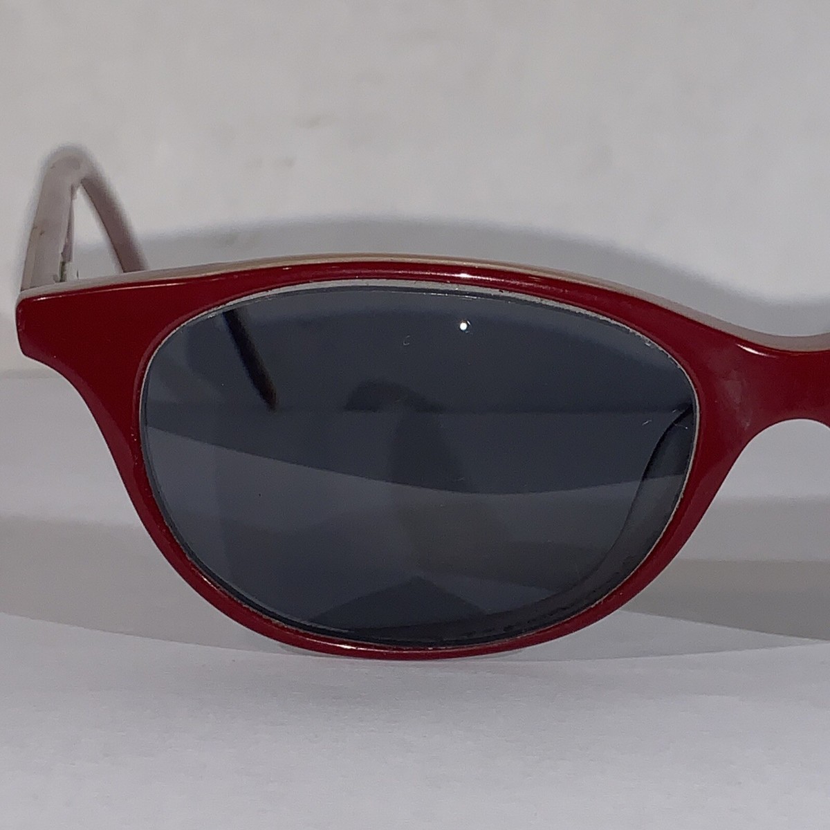 Anne Klein women’s sunglasses.  Burgundy frames with rose colored lenses. Case. Anne Klein AK7094 Sunglasses | Select Eyewear main image 2