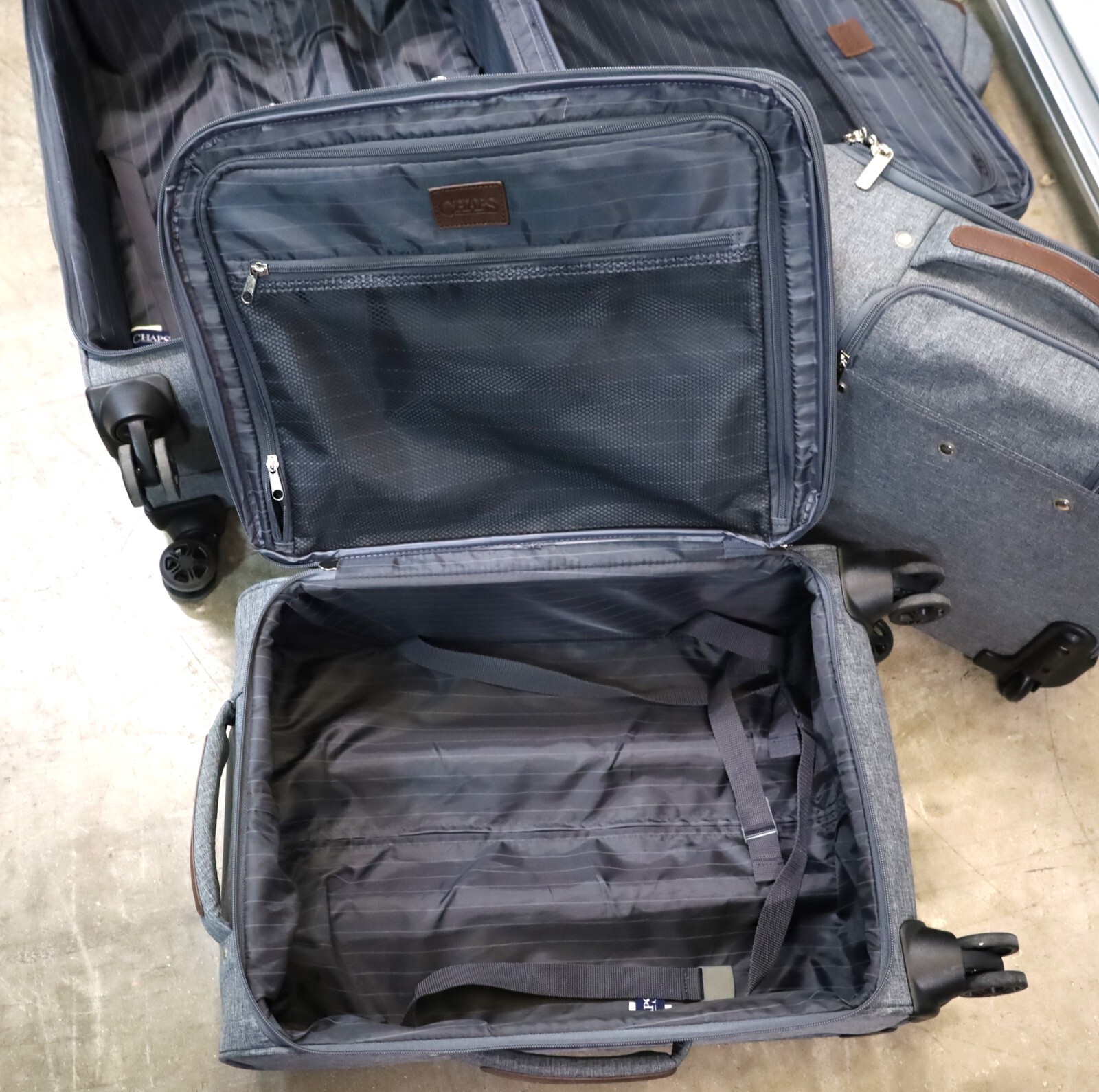 Chaps 4-Piece Luggage Set - Gray fabric w/ brown trim - 3 pieces have rollers