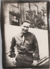 WW2 Photo of Soldier Standing by Apartment Courtyard Window