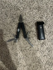 Leatherman’s Tool Nissan Black With 8 Attachments, Pliers, And Leather Sheath