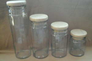 clear storage jars with wooden lids