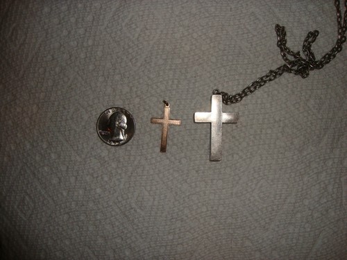 9 kt gold cross and hollow silver cross with silver chain