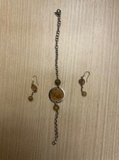 Bracciale e orecchini Alviero martini, in acciaio e pelle