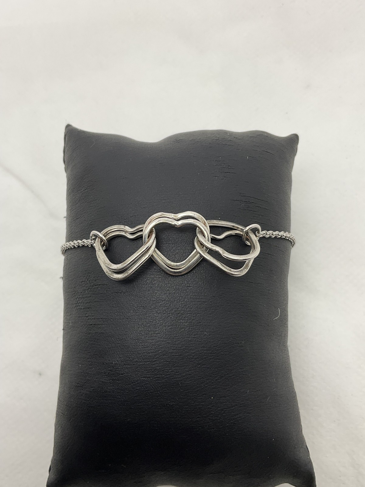 Juicy Couture Silvertone Interlocking Hearts Brac… - image 1