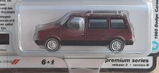 2024 Auto World Mighty Minivans 1985 Dodge Caravan 1:64 in Crimson Red/Black