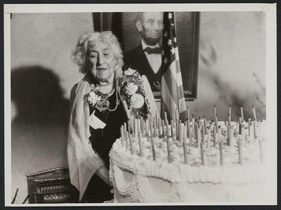 Nurse Margaret Hayes with her birthday cake celebrating her 100th birthday