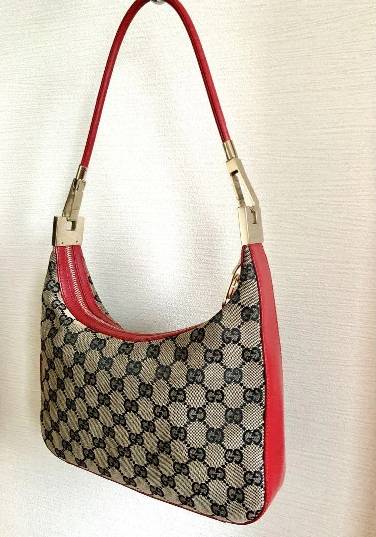 Sac bandoulière Gucci Gucci Gg toile cuir rouge design élégant accessoire luxe