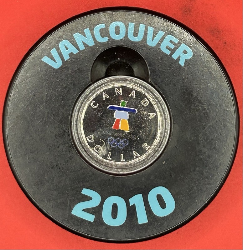 Vancouver 2010 Olympic Puck with Sterling Silver Lucky Loon $ Dollar. Rare In US