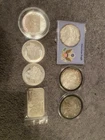 silver lot .999 7oz Silver Coins And A Bar