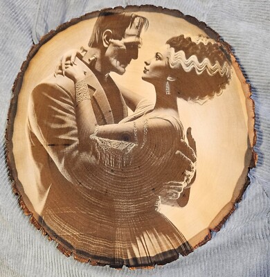Frankenstein type monster with bride Engraved Wood Live edge Picture