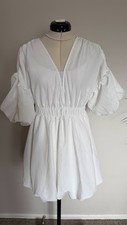 White Puffy Mini Dress with Puffy Sleeves sizeS waist- on the cutout V neckline