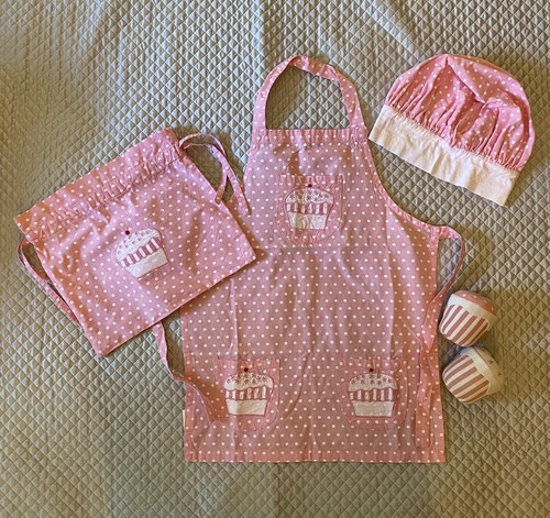 girls chef outfit with two toy cupcakes 