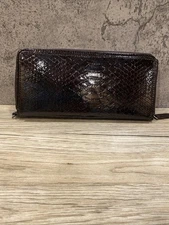 Avon Mark catalog wallet zipper around woman’s wallet