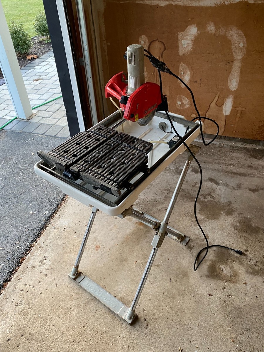 Husky wet saw ( 7 In. Wet Tile Saw w/ Laser and Stand ) - $275