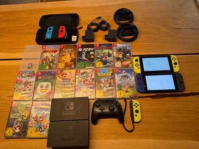   Nintendo Switch Komplettpaket   2 Konsolen + Zubehör + Spiele