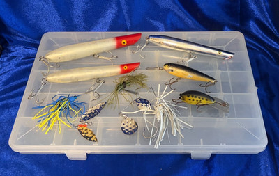 Assorted Fishing Lures In A Plano Storage Tray