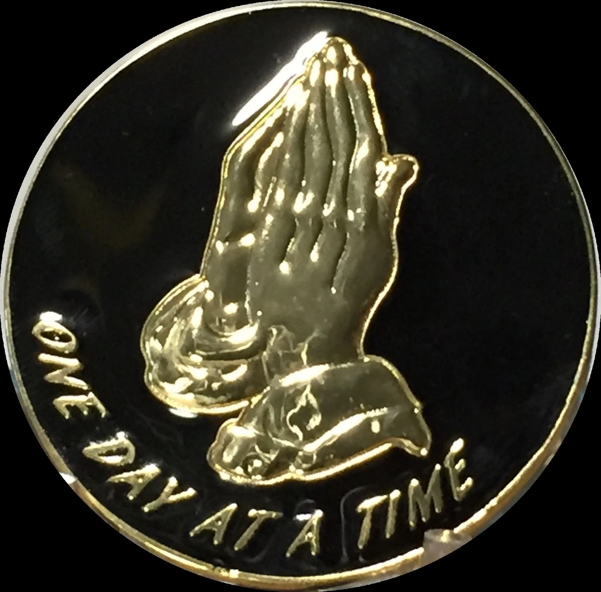 Gold prayer hands top