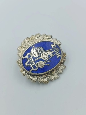 Vintage Anstecknadel mit blauem Emaille Motiv und dekorativem Metallrahmen