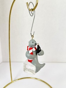 Coca Cola Company Seal Sitting On Block Of Ice Drinking Coke Christmas Ornament