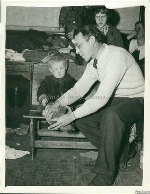 1936 Photo Young Child Receives Shoes From The Red Cross Relief Organization 7x9