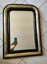 Cornice caminiera e specchio. Nera e argento bulinato a motivi floreali. 1800