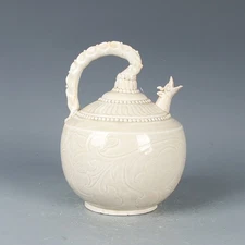 Song Dynasty Ding Kiln white-glazed carved dragon-mouth pouring spout jar