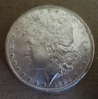 1884-CC MORGAN SILVER DOLLAR. UNCIRCULATED..