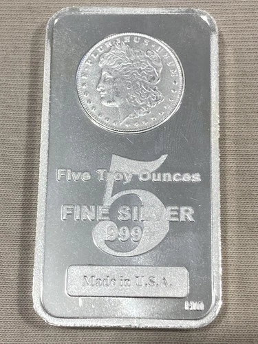 5 Troy Ounces .999+ Fine Silver (HM), Morgan Dollar Head Design. Made in U.S.A.