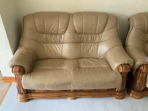 beige leather and wooden three piece suite