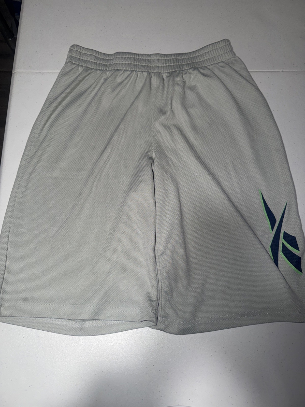 Reebok performance basketball shorts in a light grey color Size XL(18-20)