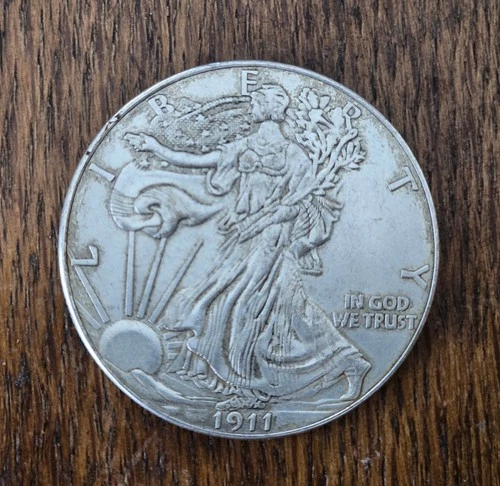 1911 Walking Liberty Silver dollar in fine-condition