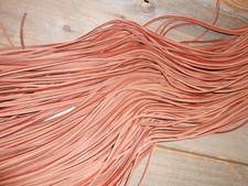 One pair of 20" long 1/8" wide rust colored rawhide leather boot / shoe laces.