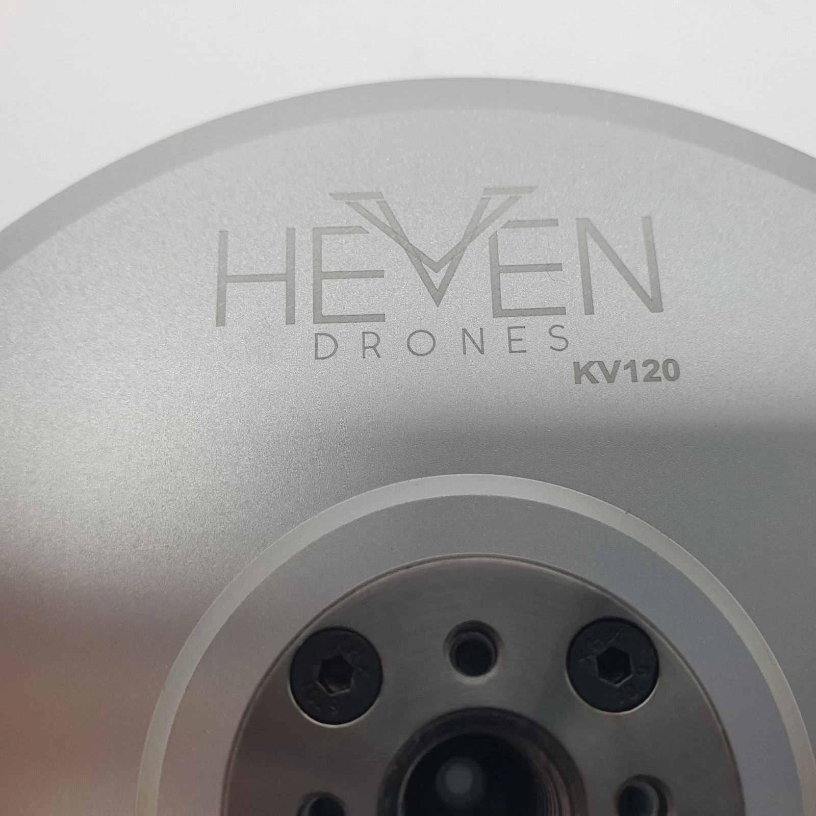 Close-up of the HEVEN DRONES KV120 engraving on the P150 motor