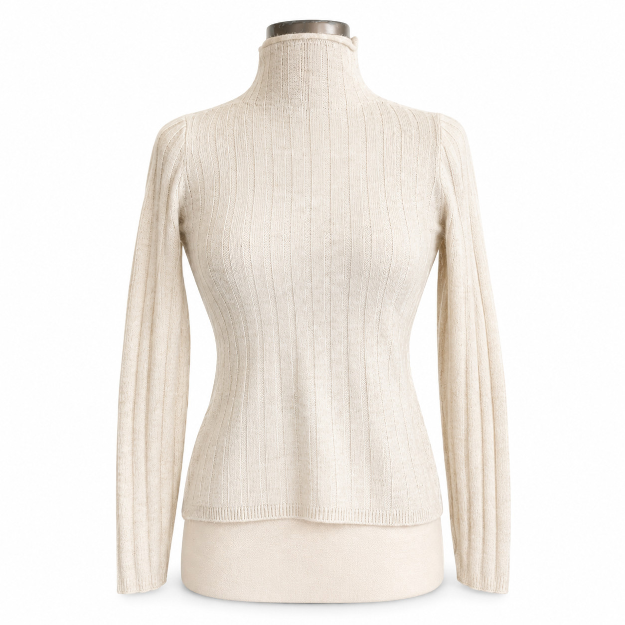Ivory ribbed merino wool and alpaca turtleneck sweater on a mannequin form.