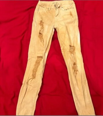 Beige ripped/distressed jeans