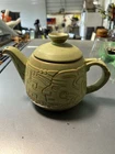 Vintage Frankoma Mayan-Aztec design teapot in a Prairie Green glaze