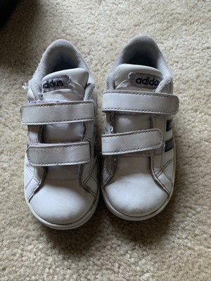 adidas white tennis shoes with black stripes