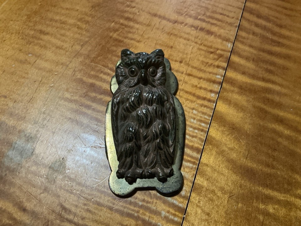 A 100+ year old cast iron owl clutching paper clips — H.L. Judd antiques are legitimately collectible and this one still has its original paint, making it a desk piece AND a conversation piece.