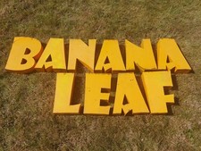 Ten metal letters spelling "Banana Leaf"
