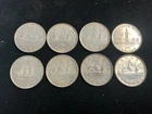 Lot of 8 Canadian silver dollars 1935-1952 see pictures