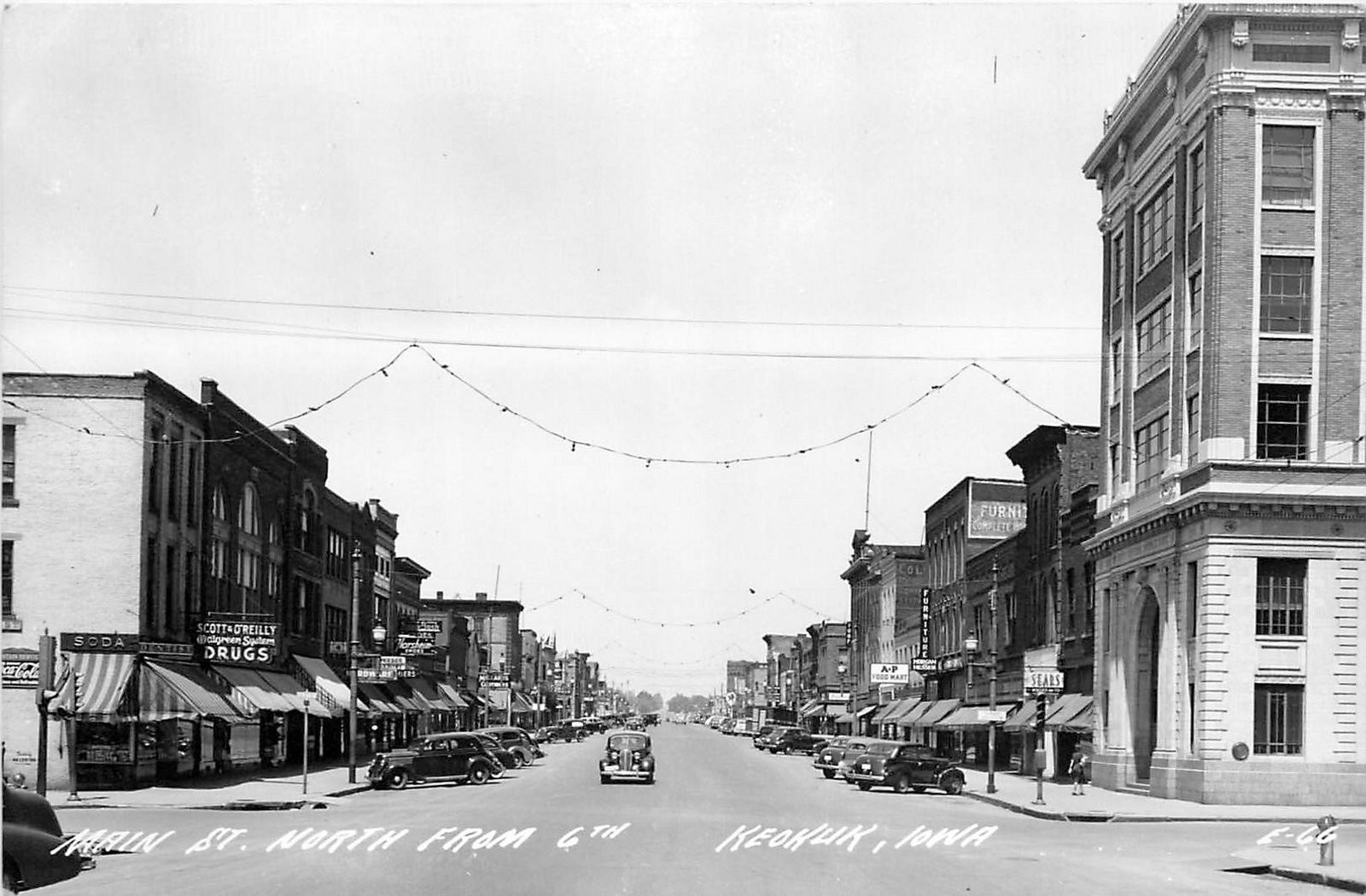 1940s Keokuk Iowa Main Street North from 6th autos Cook RPPC Postcard 25-8032